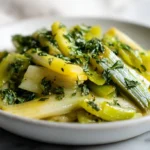 Poireaux savoureux cuits à l’Airfryer, tendres et légèrement caramélisés.